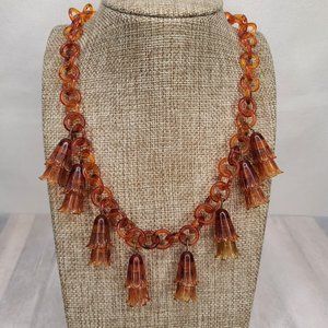 Vintage celluloid faux tortoise necklace with flower blossom charms. Pinup